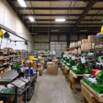 Manufacturing floor showing materials, work-in-progress assemblies, and completed electromechanical products throughout the turnkey assembly process at General Assembly & Manufacturing Corp.